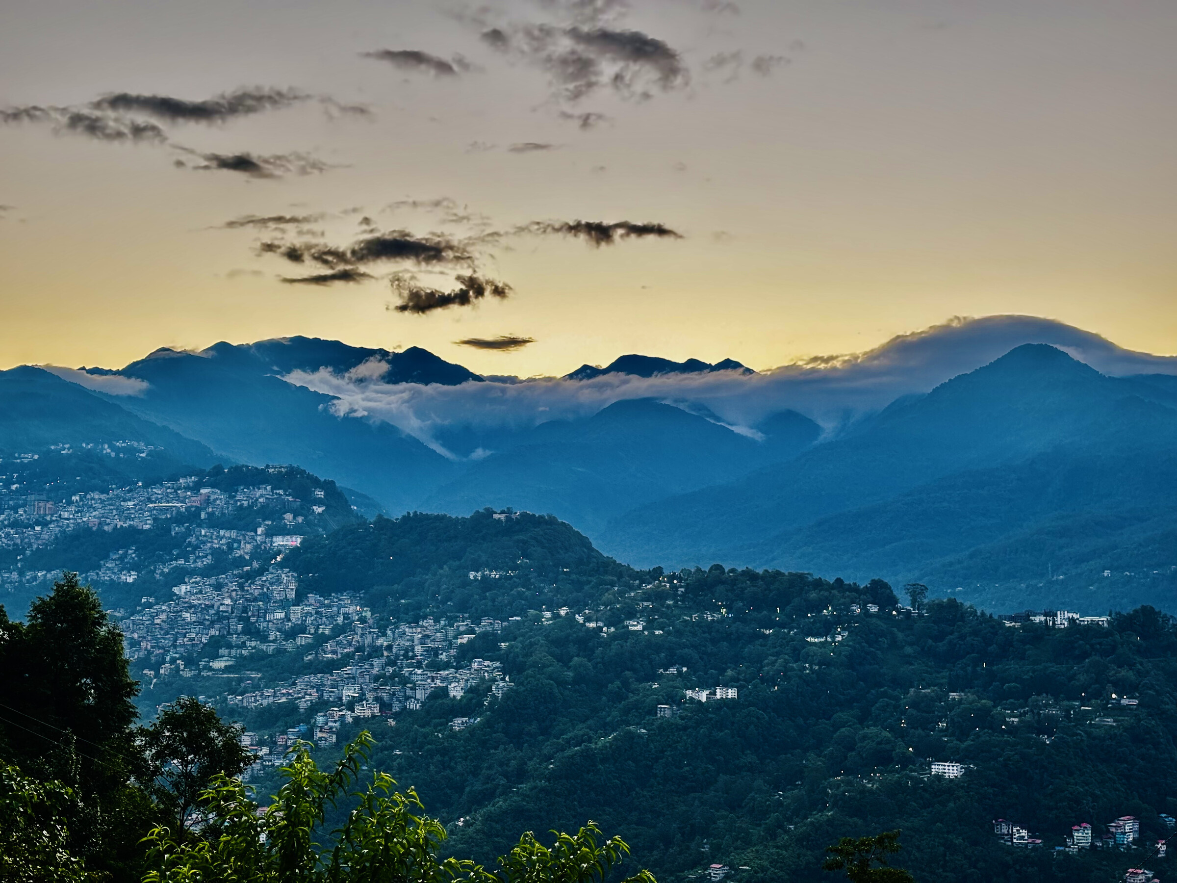 Dusk over the Himalayan ranges and hillside town seen from Arosia Hotels